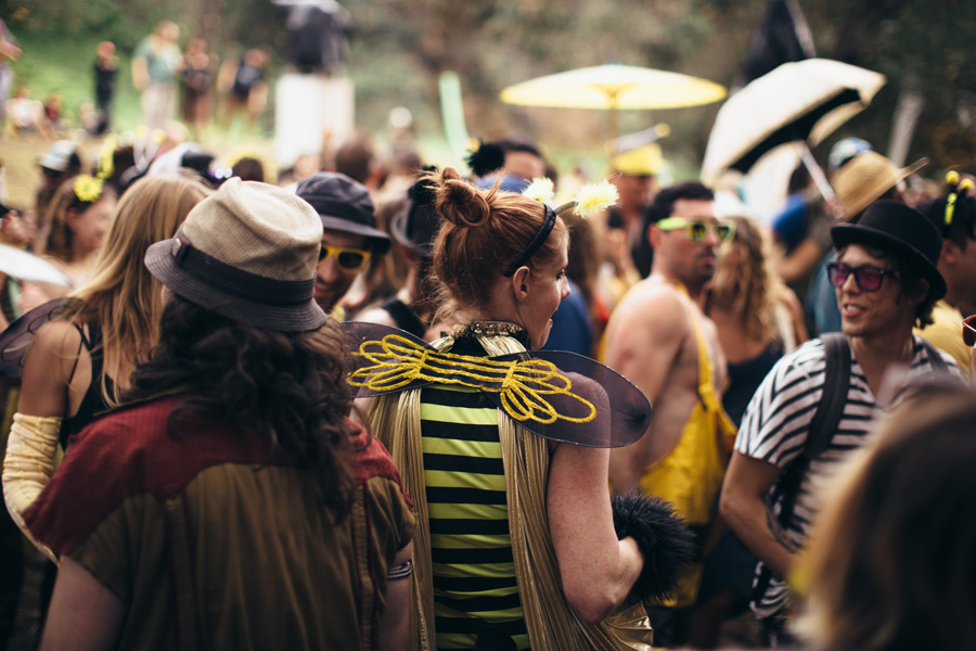 a woman in a bee costume among many others in other costumes